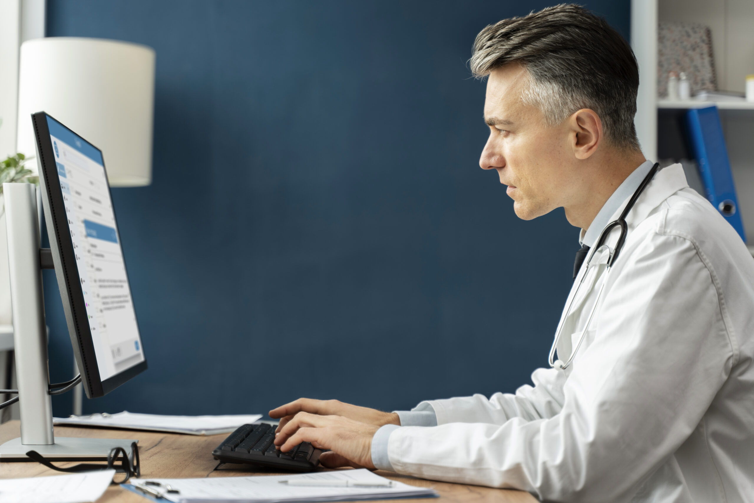 HIPAA Consulting Group doctor typing on computer