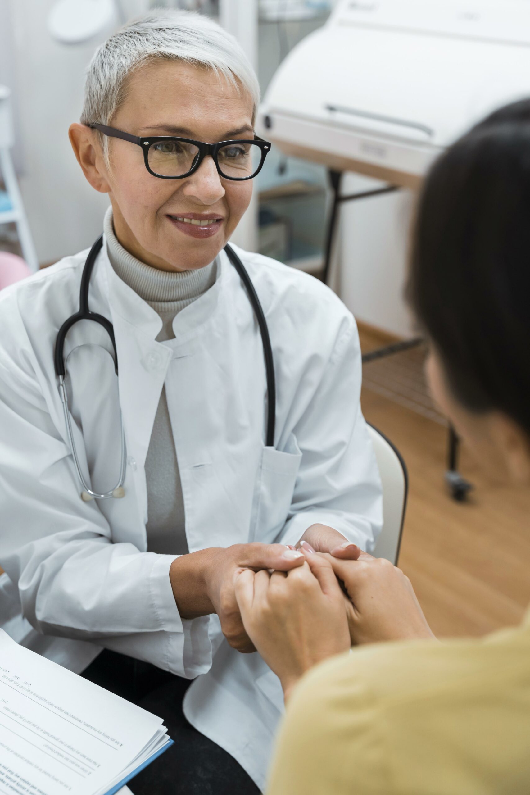 HIPAA compliance doctor holding patient hands